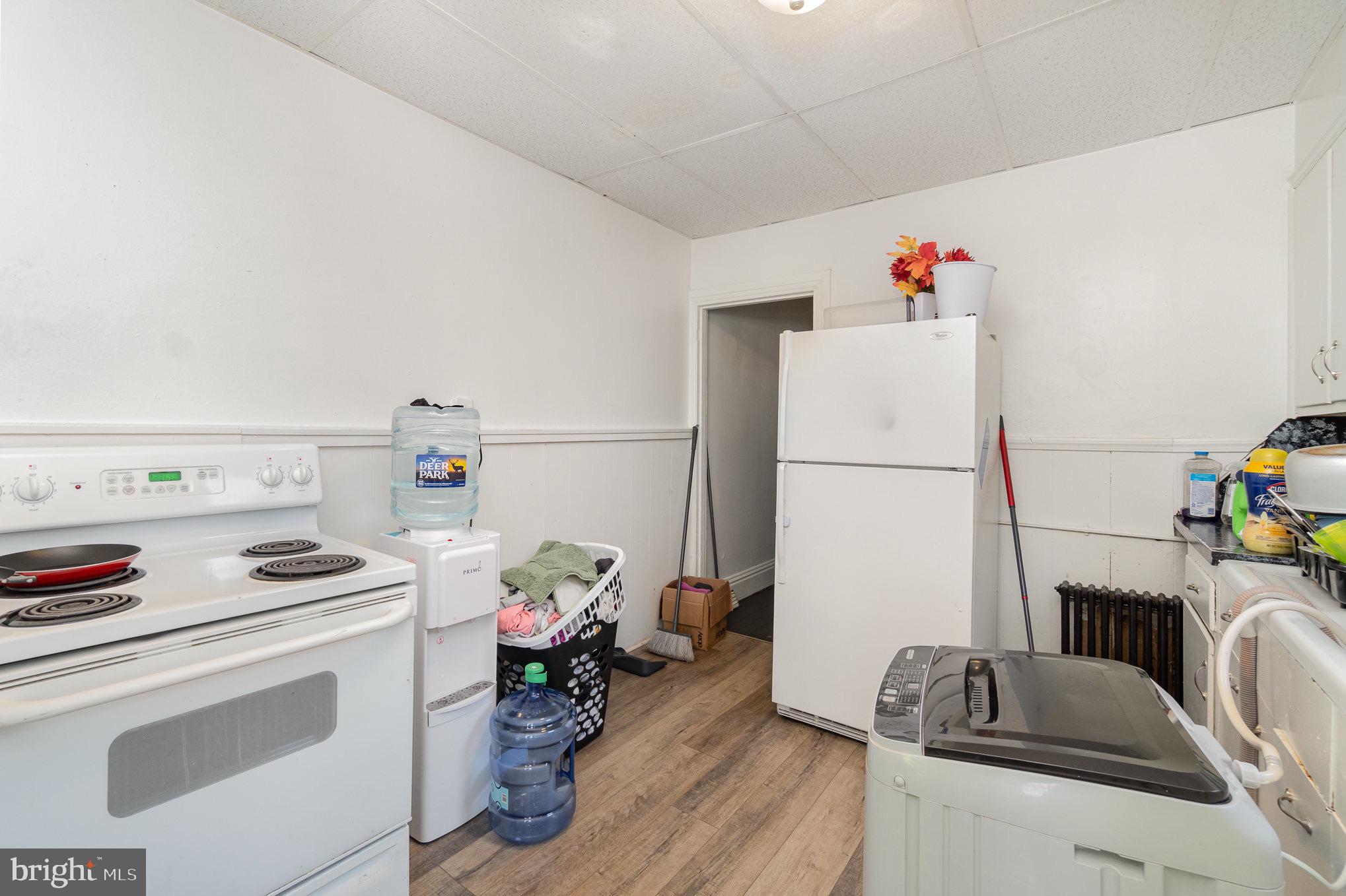 281 West Cottage Place York, PA 17401 - Photo 5 of 30 a kitchen with a refrigerator and a stove top oven