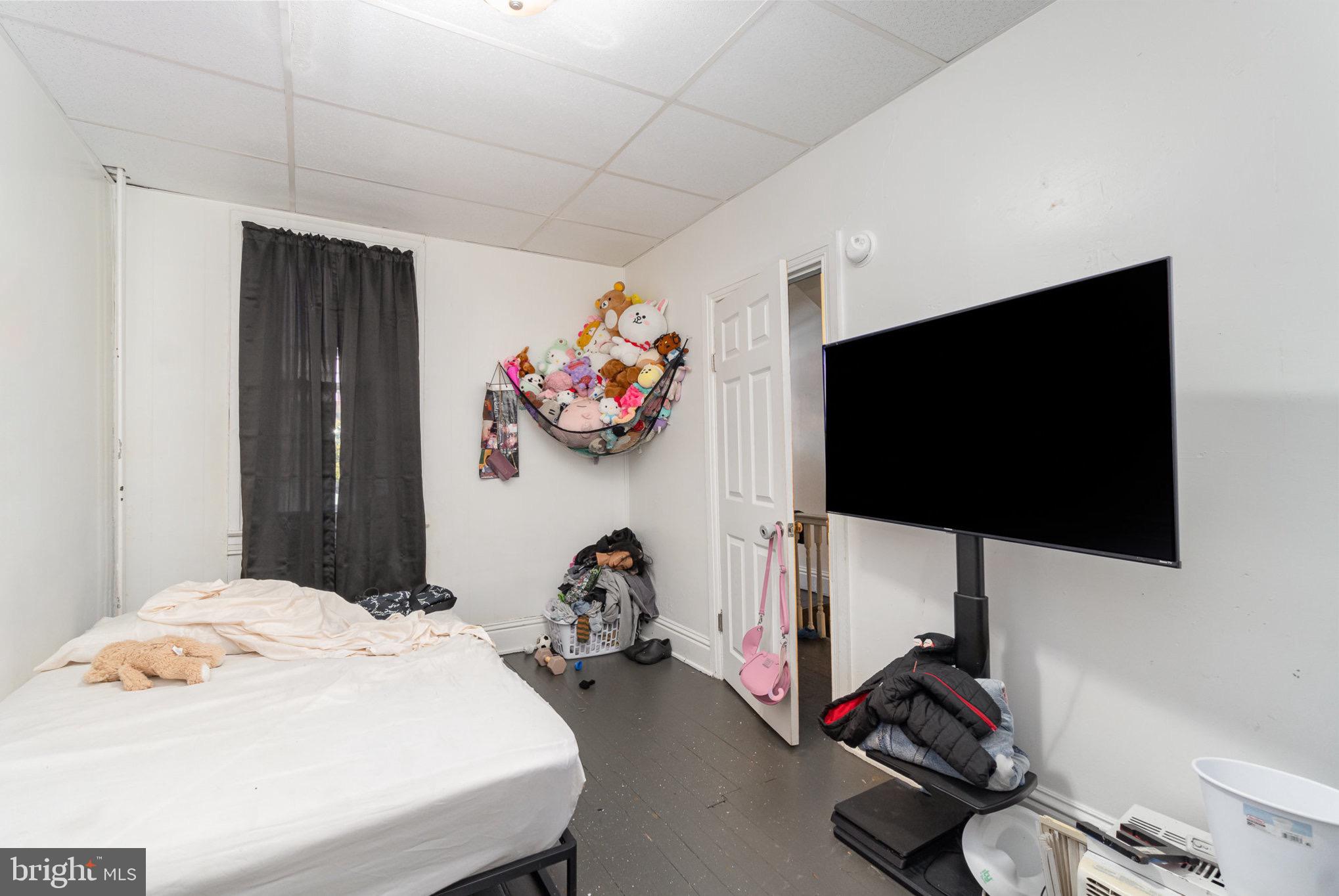 281 West Cottage Place York, PA 17401 - Photo 7 of 30 a bedroom with a bed and a flat screen tv