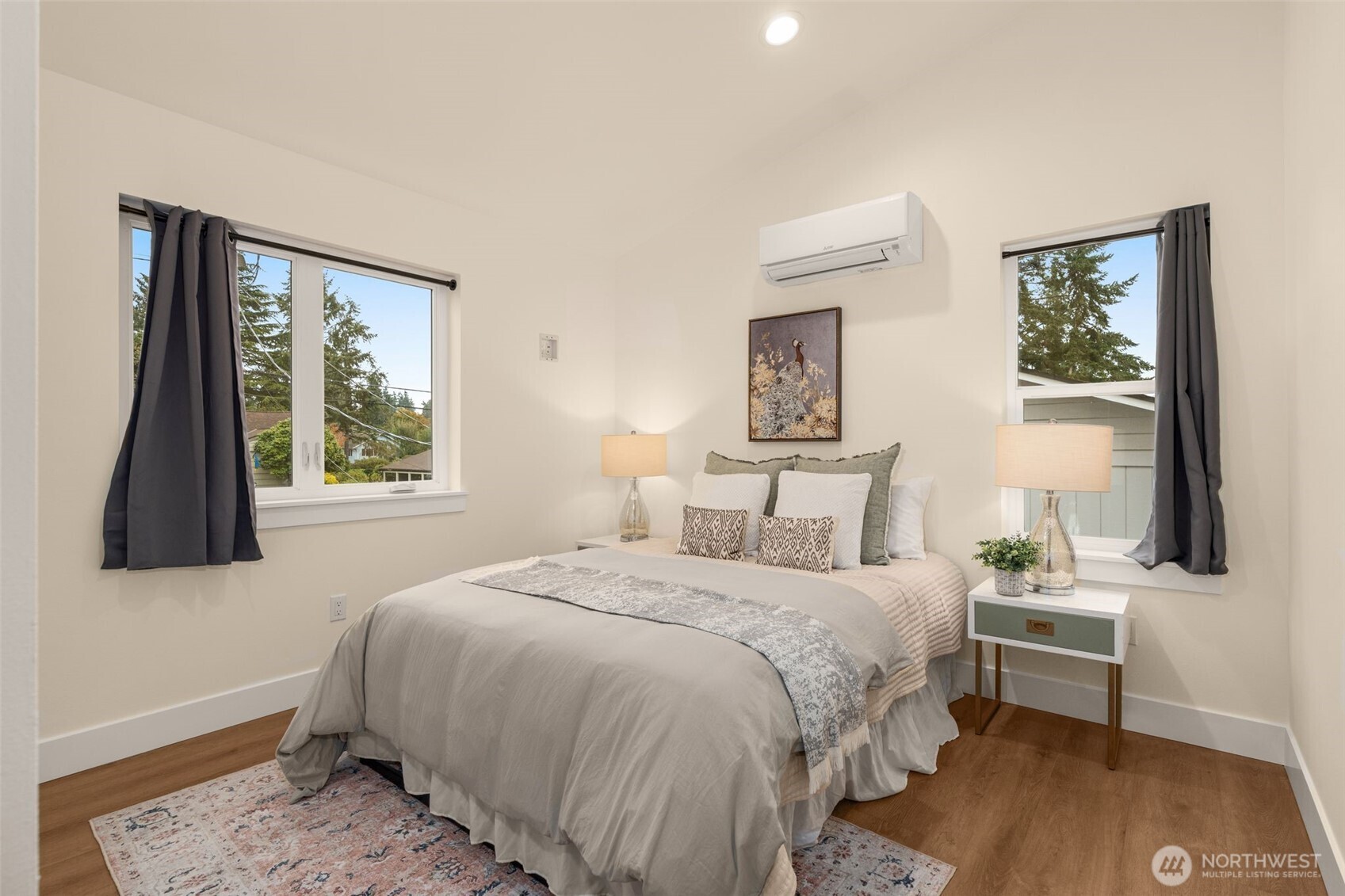 9253 6th Avenue Northwest, Unit B Seattle, WA 98117 - Photo 12 of 24 a bedroom with a bed and a window