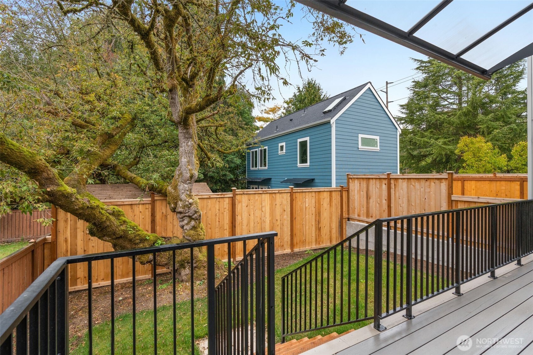 9253 6th Avenue Northwest, Unit B Seattle, WA 98117 - Photo 18 of 24 a view of a wooden fence