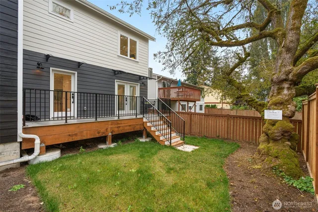 a view of a house with a yard and sitting area