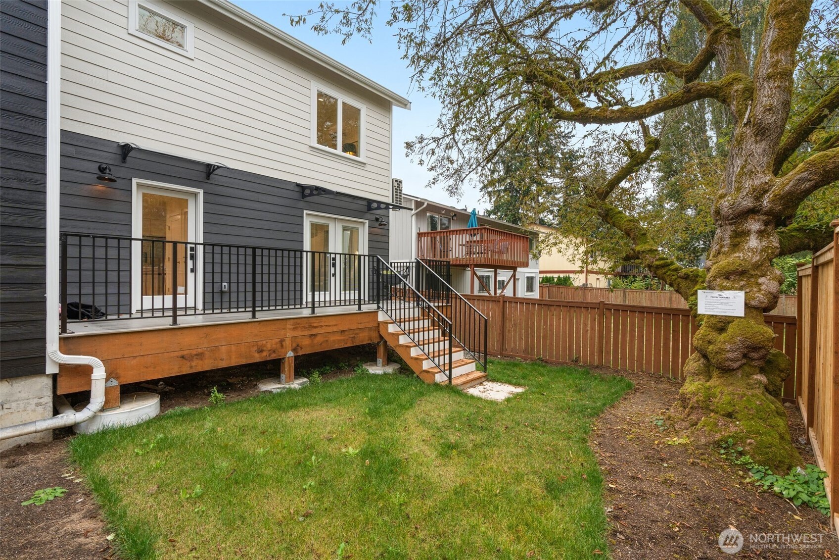 9253 6th Avenue Northwest, Unit B Seattle, WA 98117 - Photo 19 of 24 a view of a house with a yard and sitting area