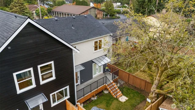 a aerial view of a house with a yard