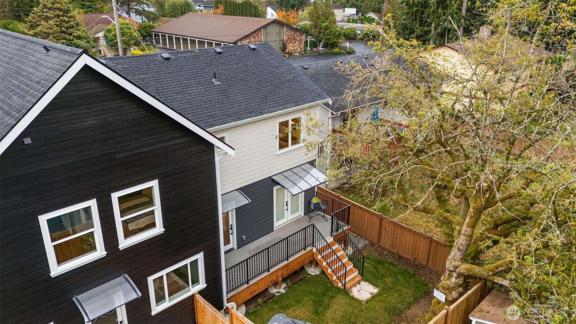 9253 6th Avenue Northwest, Unit B Seattle, WA 98117 - Photo 20 of 24 a aerial view of a house with a yard