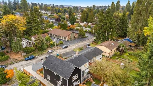 an aerial view of residential houses with outdoor space