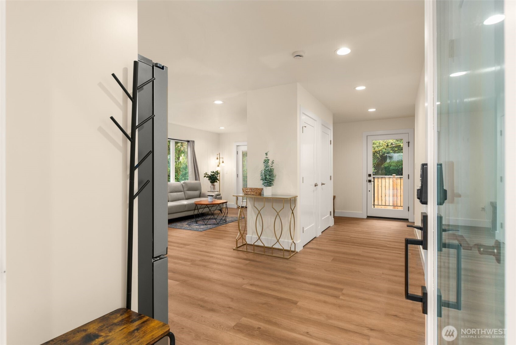 9253 6th Avenue Northwest, Unit B Seattle, WA 98117 - Photo 3 of 24 a view of a living room and a wooden floor