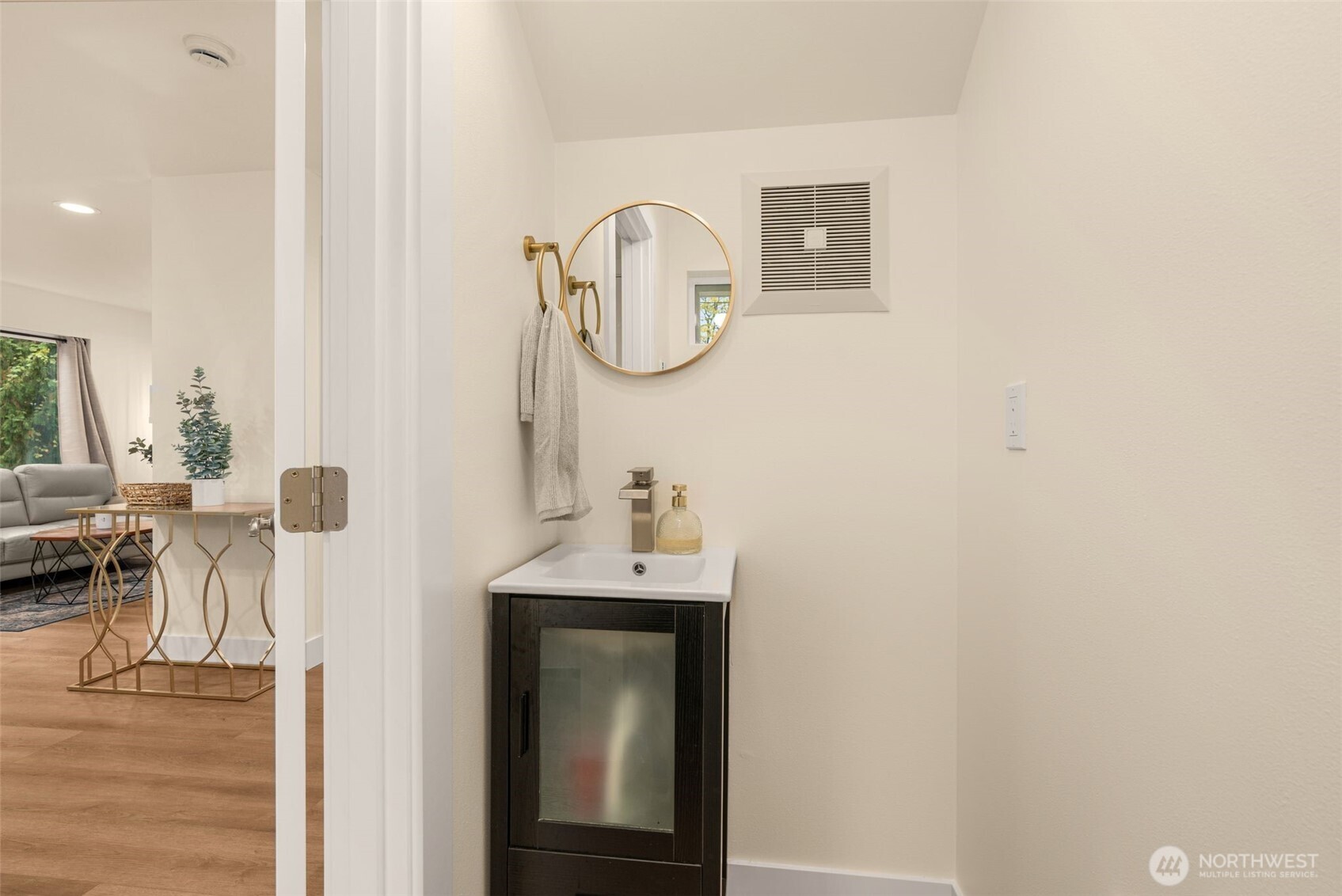 9253 6th Avenue Northwest, Unit B Seattle, WA 98117 - Photo 9 of 24 a bathroom with a sink and a mirror