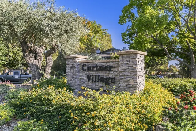 a view of a kitchen with a sink and cabinets