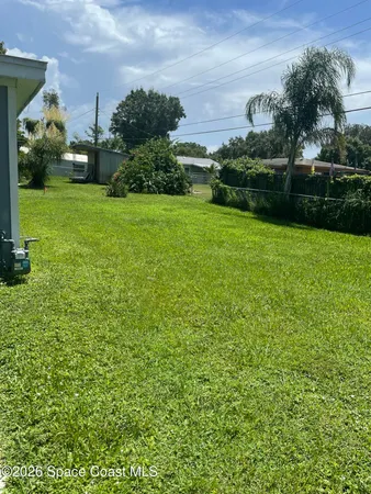 a view of a garden with houses