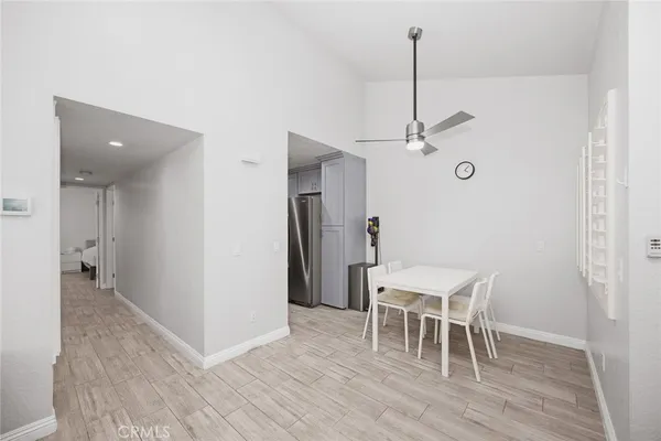 a dining room with furniture and a window