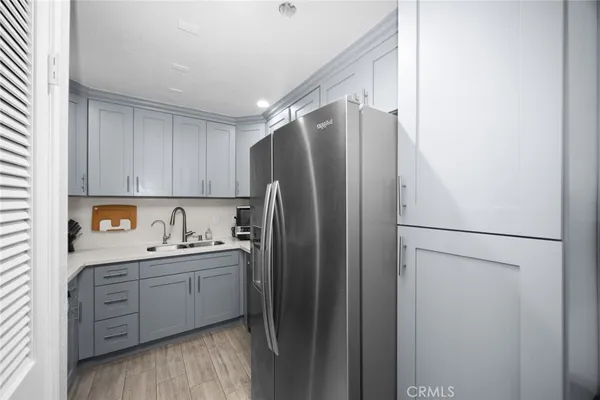 a kitchen with stainless steel appliances a sink stove and cabinets