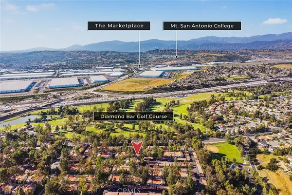 a view of a swimming pool and lounge chairs