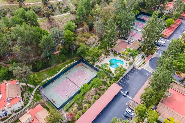 a swimming pool with outdoor seating and yard