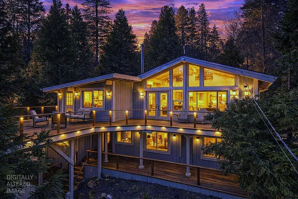 a view of a house with swimming pool and sitting area