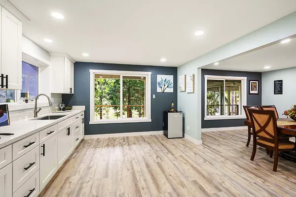 a view of a dining room with furniture and wooden floor