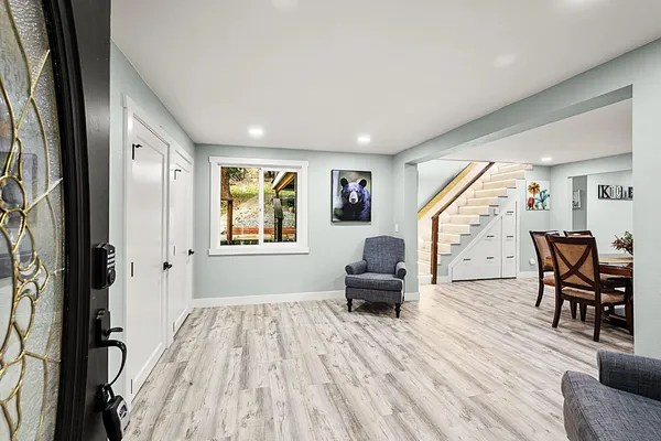 a bedroom with a bed and a night stand