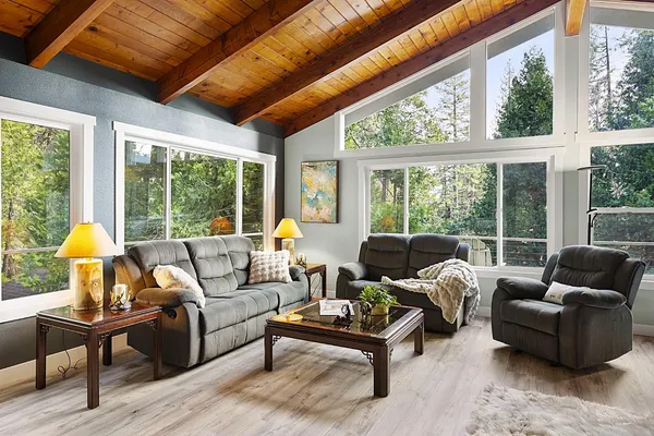 a living room with furniture and a large window