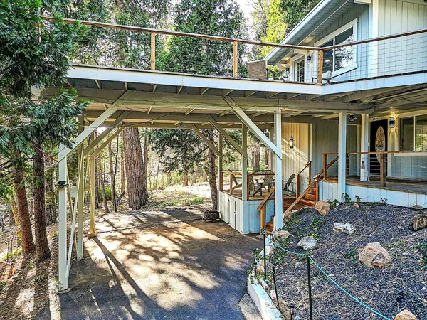 a view of balcony with wooden floor and fence