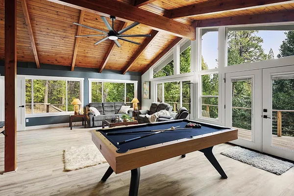 a view of a livingroom with furniture and a window