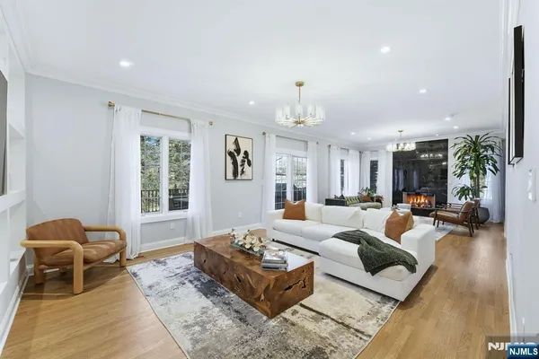 a living room with furniture rug and window