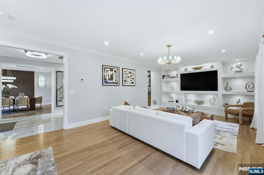 204 Bearwoods Road Park Ridge, NJ 07656 - Photo 12 of 39 a living room with furniture and a flat screen tv