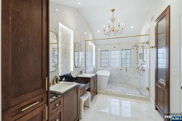 a spacious bathroom with a shower sink mirror and a bathtub