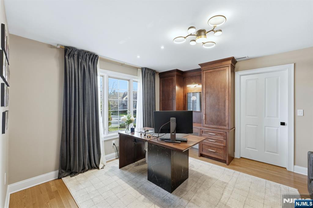 204 Bearwoods Road Park Ridge, NJ 07656 - Photo 19 of 39 a view of a workspace with furniture and a window