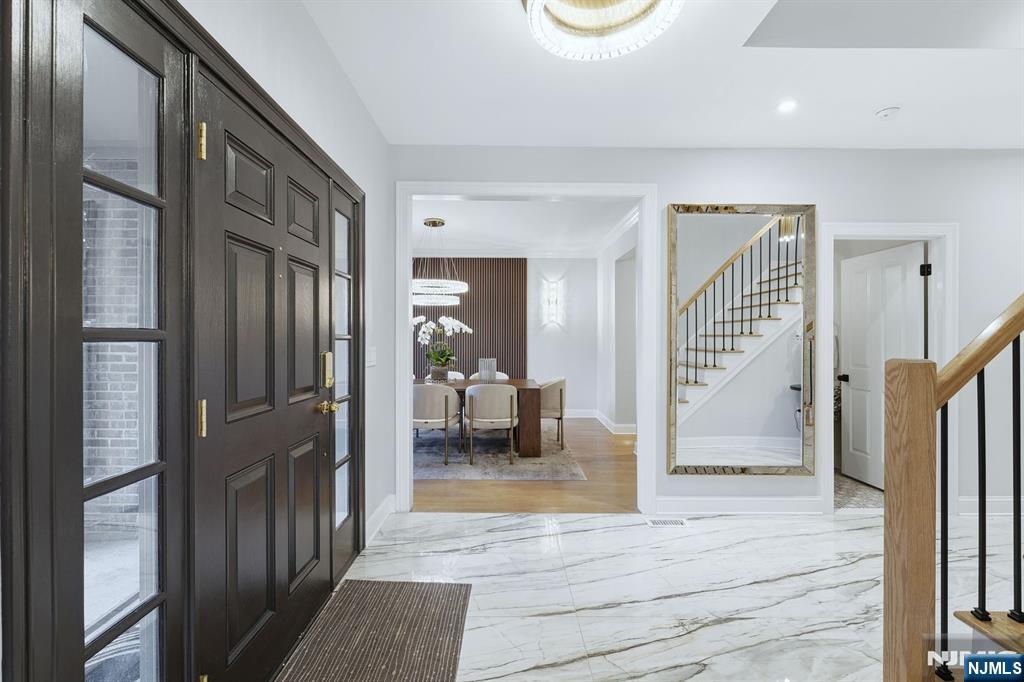 204 Bearwoods Road Park Ridge, NJ 07656 - Photo 3 of 39 a view of a hallway view with staircase and living room
