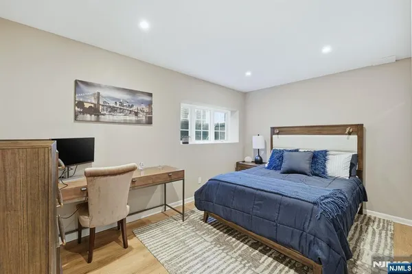 a bedroom with a bed and furniture