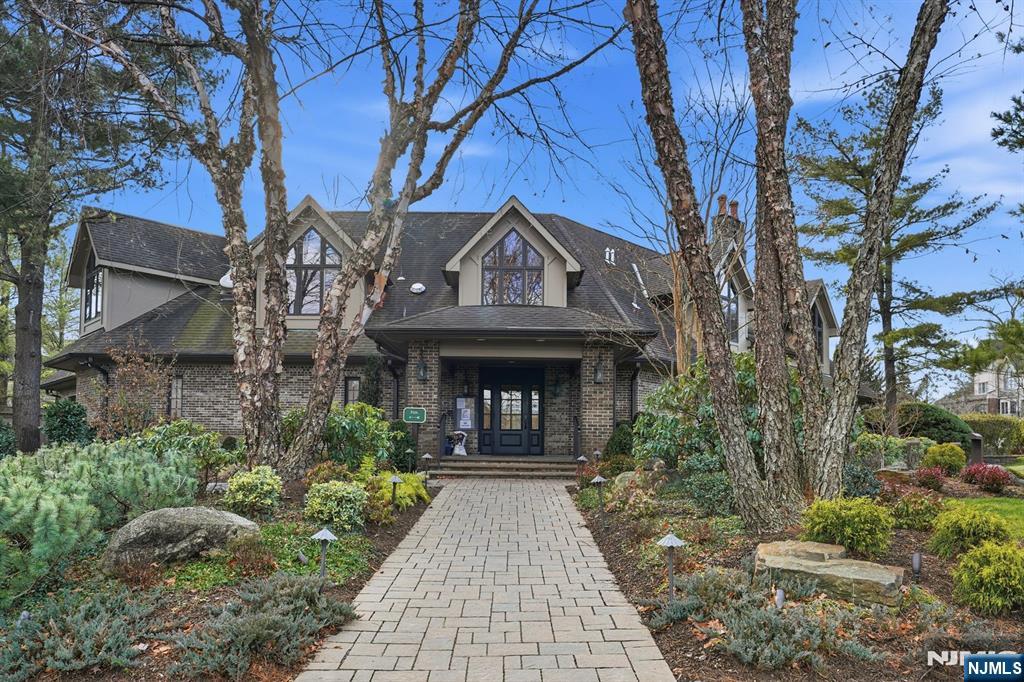 204 Bearwoods Road Park Ridge, NJ 07656 - Photo 34 of 39 a front view of a house with garden