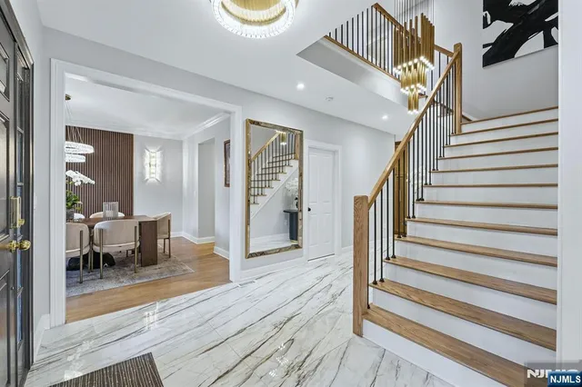 a view of entryway livingroom and hall with wooden floor