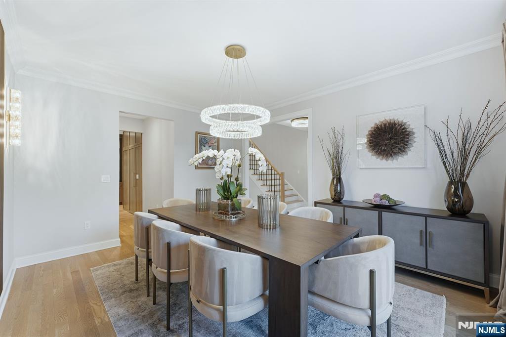 204 Bearwoods Road Park Ridge, NJ 07656 - Photo 6 of 39 a dining room with furniture and wooden floor