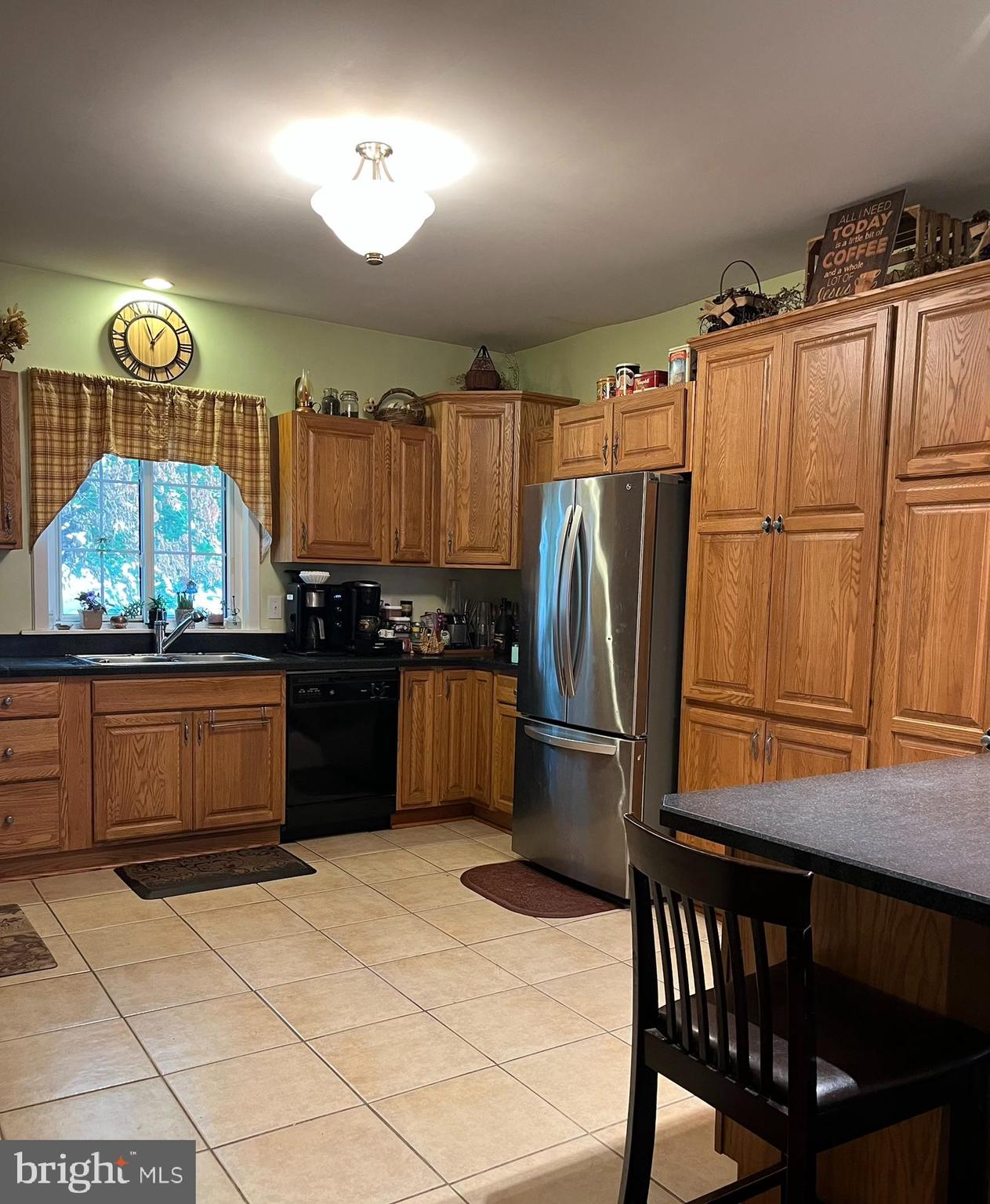 318 West Main Street Valley View, PA 17983 - Photo 13 of 46 a kitchen with a wooden floor and a refrigerator