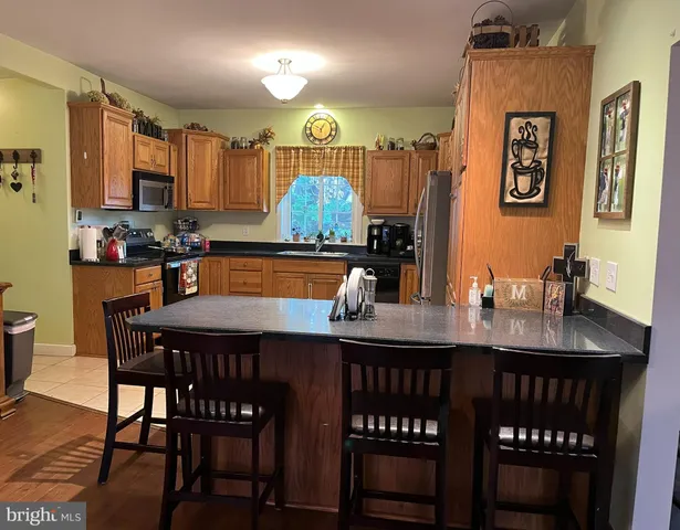 a dining table with chairs and window