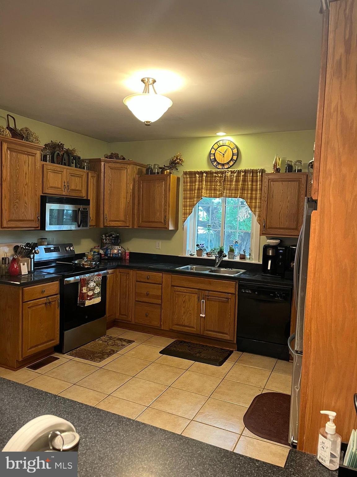 318 West Main Street Valley View, PA 17983 - Photo 15 of 46 a kitchen with stainless steel appliances granite countertop a stove a sink and a microwave