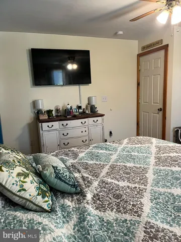 a bathroom with a sink toilet and mirror