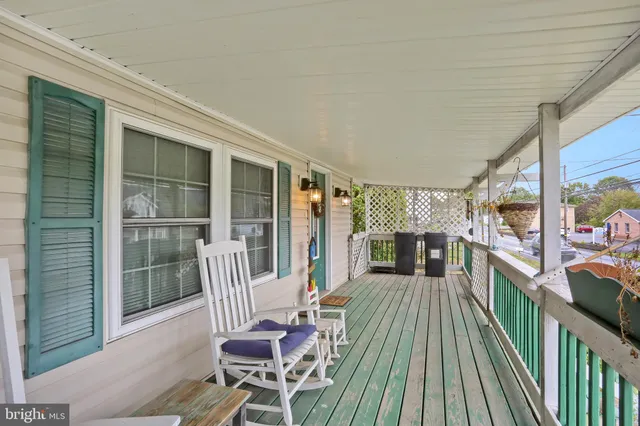 a view of a balcony with chairs