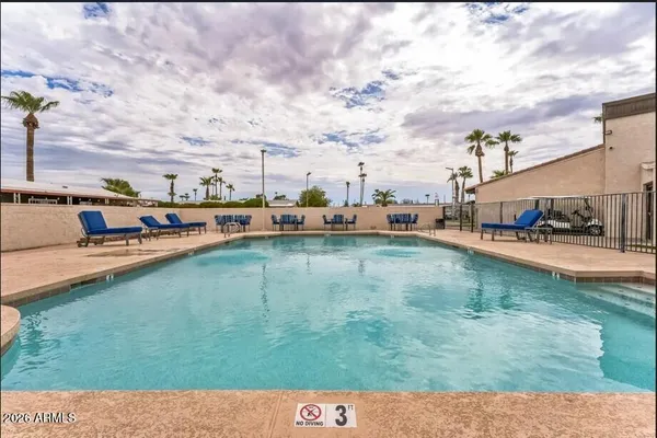 a view of swimming pool from a yard