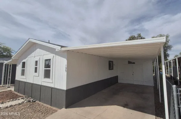a view of house with deck and front door