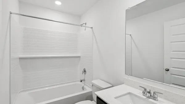 a bathroom with a shower and a sink