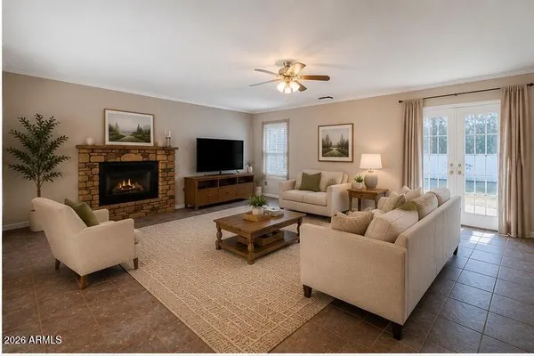 a living room with furniture flat screen tv and a fireplace