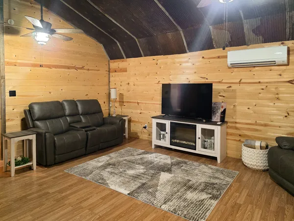 a living room with furniture and a flat screen tv