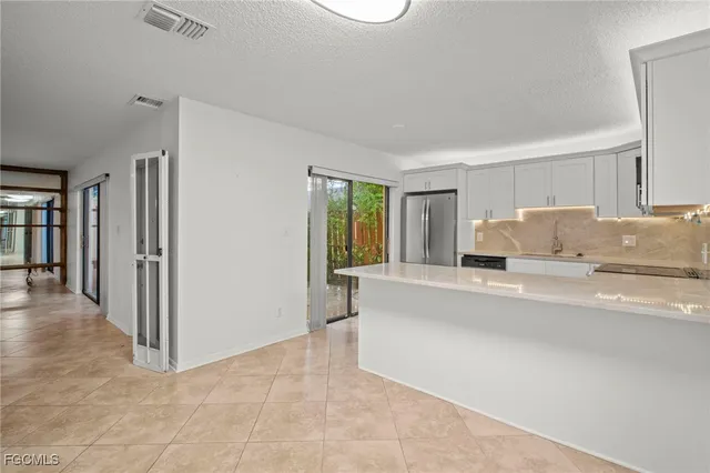 a living room with a couch and a window