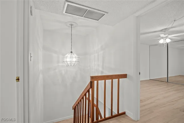 a view of a hallway with windows