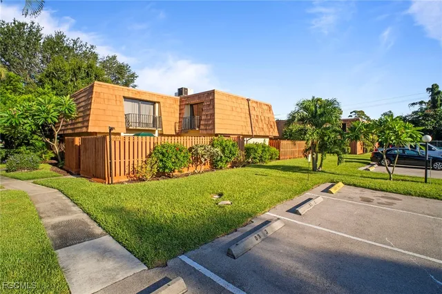 a view of a street with a large trees