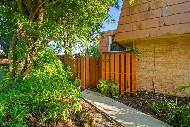 a view of a backyard with potted plants