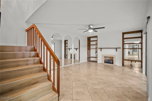 a view of a livingroom with an empty space and a fireplace