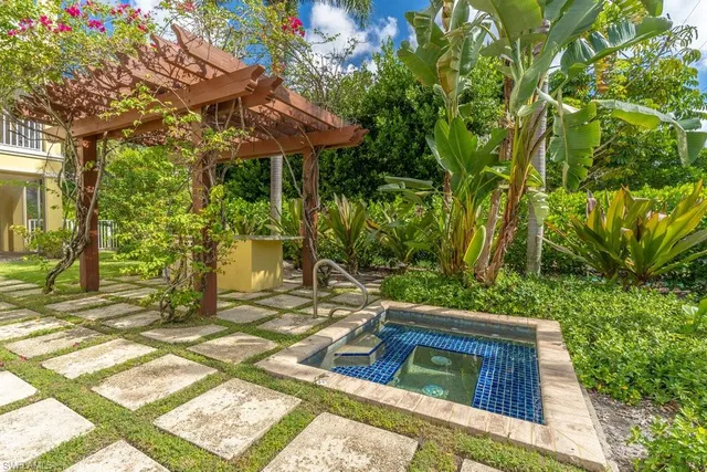 a view of a yard with an outdoor seating
