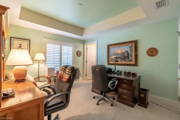 a bathroom with a granite countertop sink toilet and a mirror