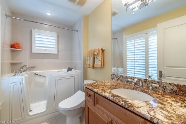 a bedroom with a bed and furniture